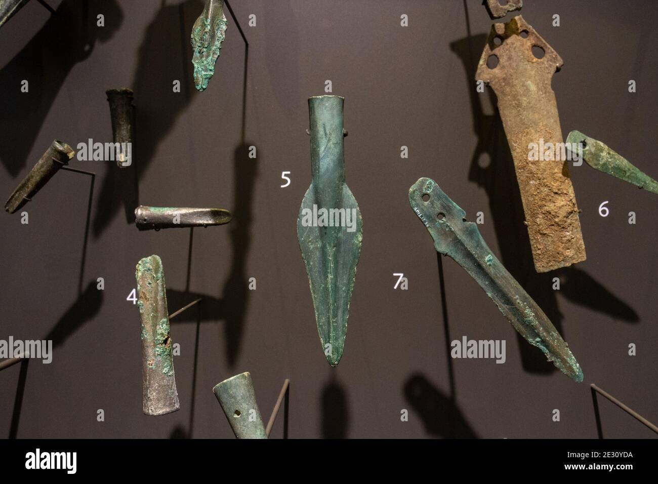 Objects from the Wardour Hoard (2700 years old) including axe heads, spearheads and daggers, The Salisbury Museum, Salisbury, Wiltshire, UK. Stock Photo