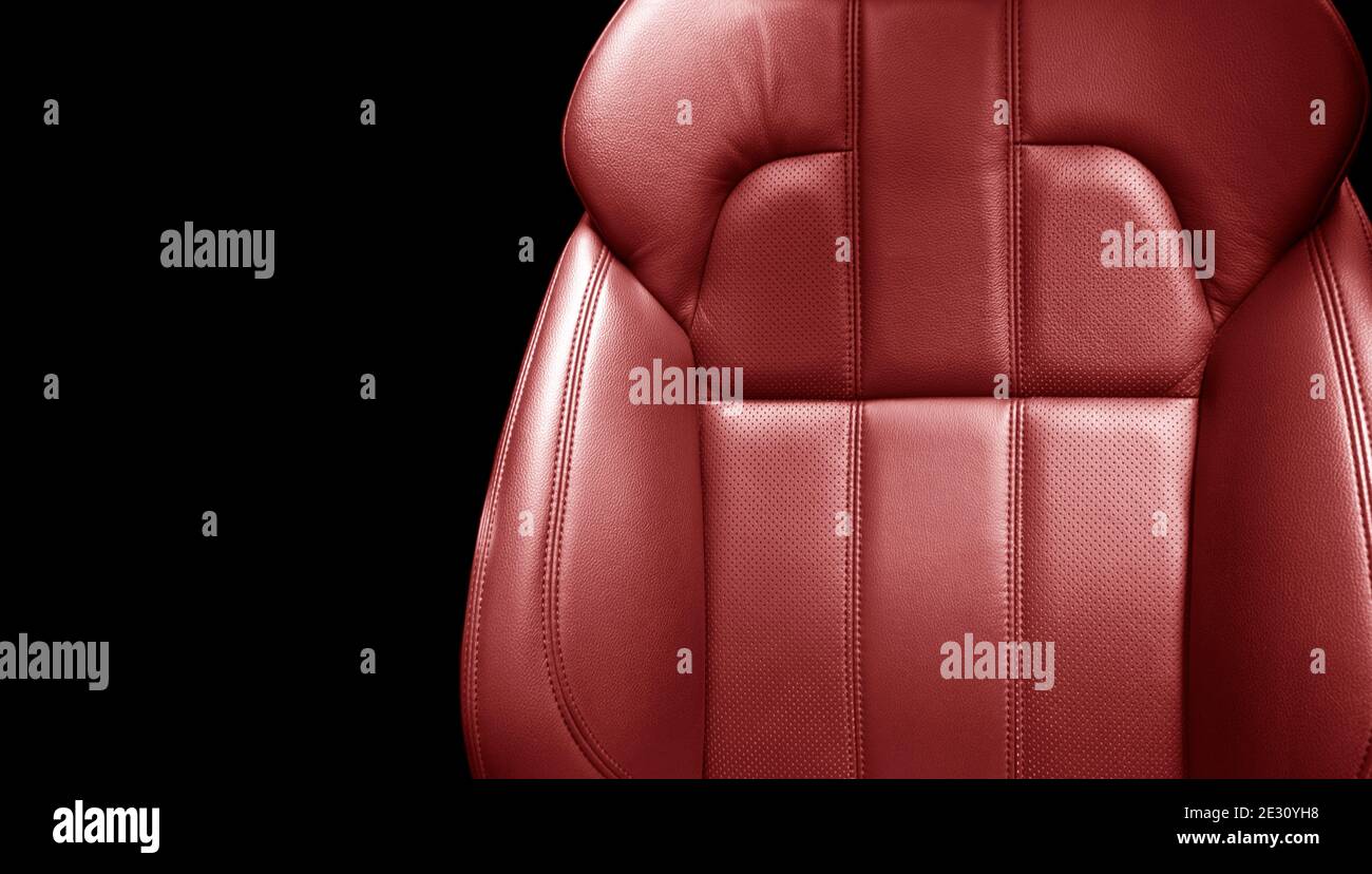 Modern luxury car red leather interior. Part of red leather car seat