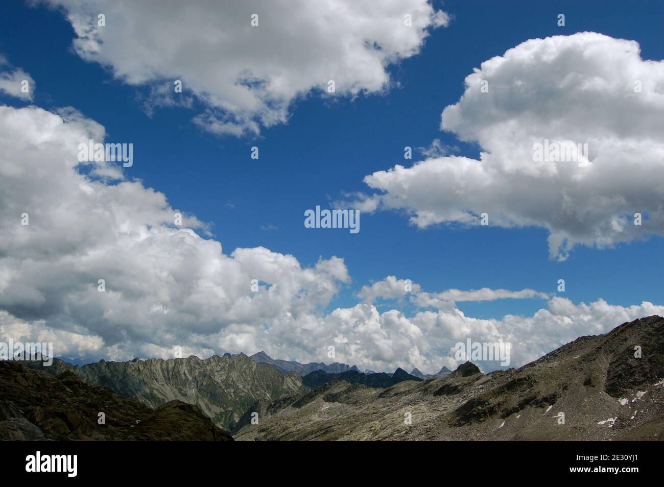 Beautiful shot of rocky mountains under a cloudy sky Stock Photo - Alamy