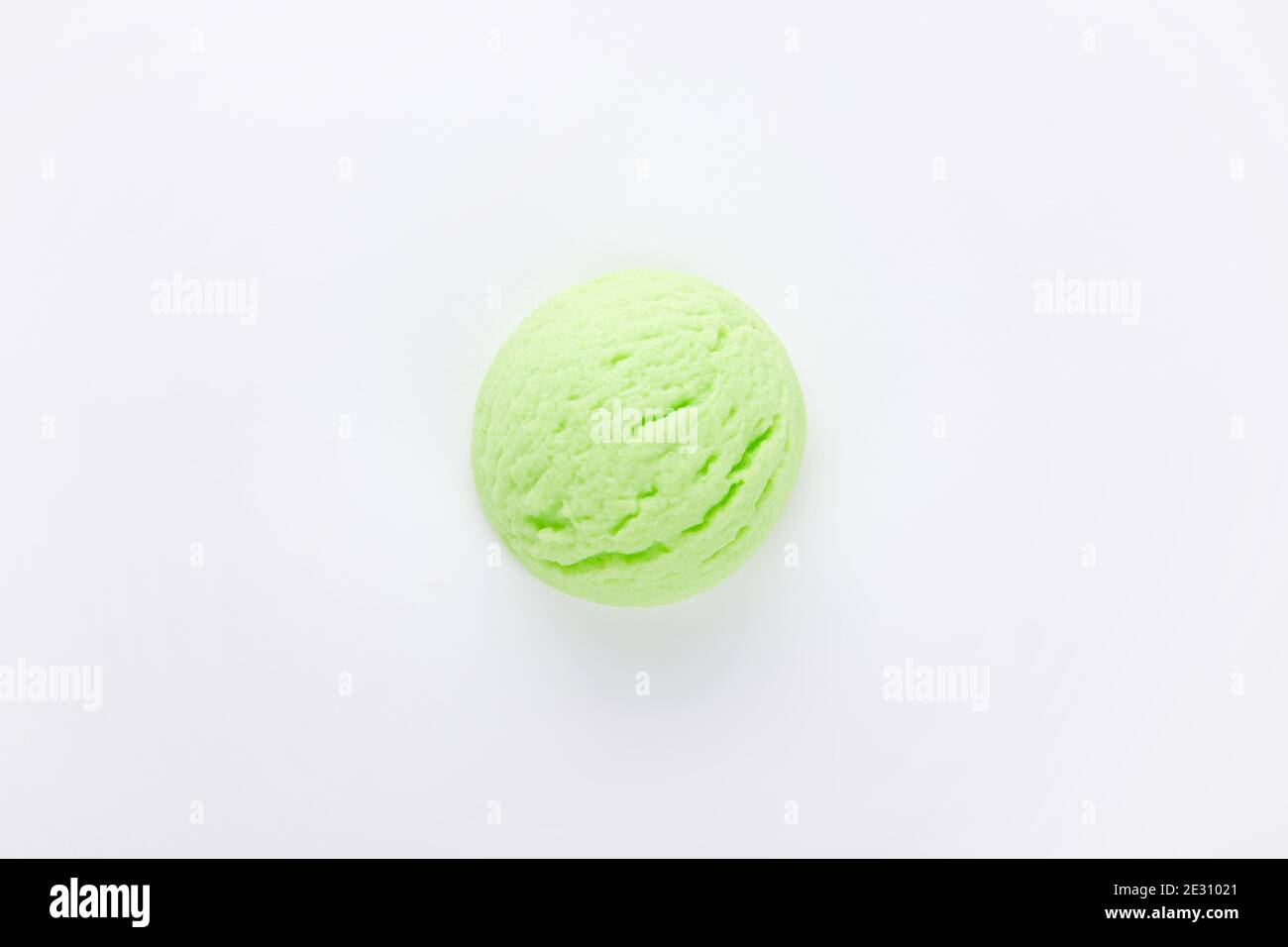 Top view of a delicious pistachio ice cream scoop isolated on a white ...