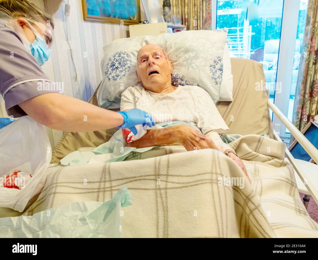 Patient Skin Is Ripped Using Covid-19 protection,a district nurse dresses the 95 year old man ...