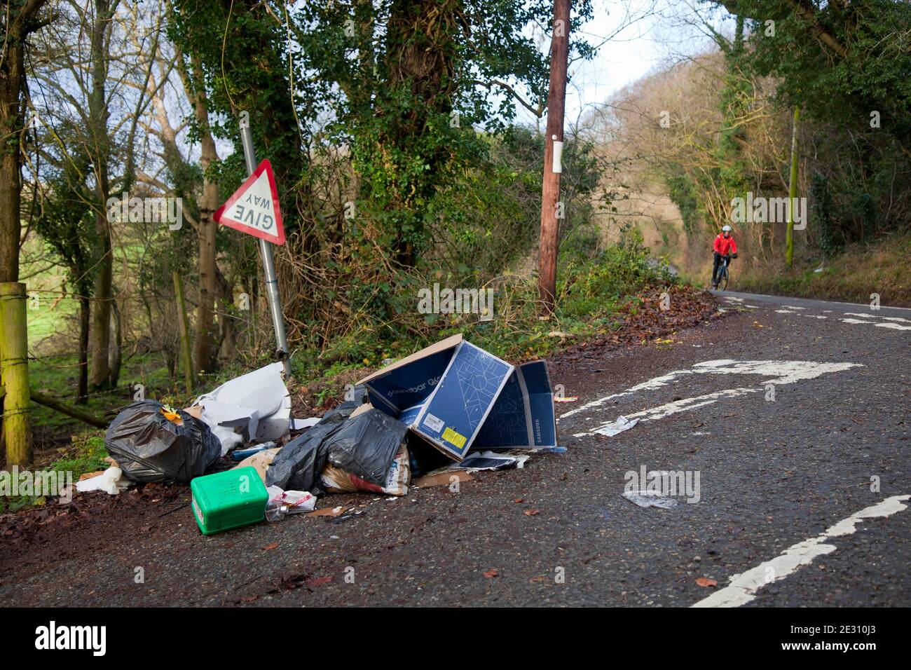 Fly - tipping of unwanted household rubbish on the roadside near to Westerham in Kent, England.  December 2020 Stock Photo