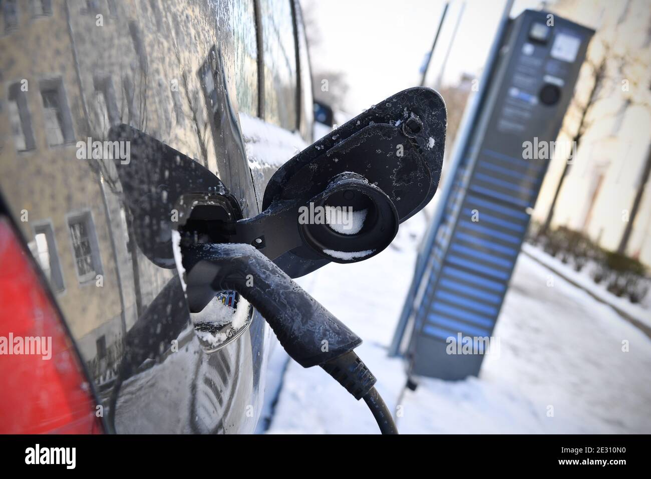 Munich, Deutschland. 15th Jan, 2021. Charging an electric car in winter ...