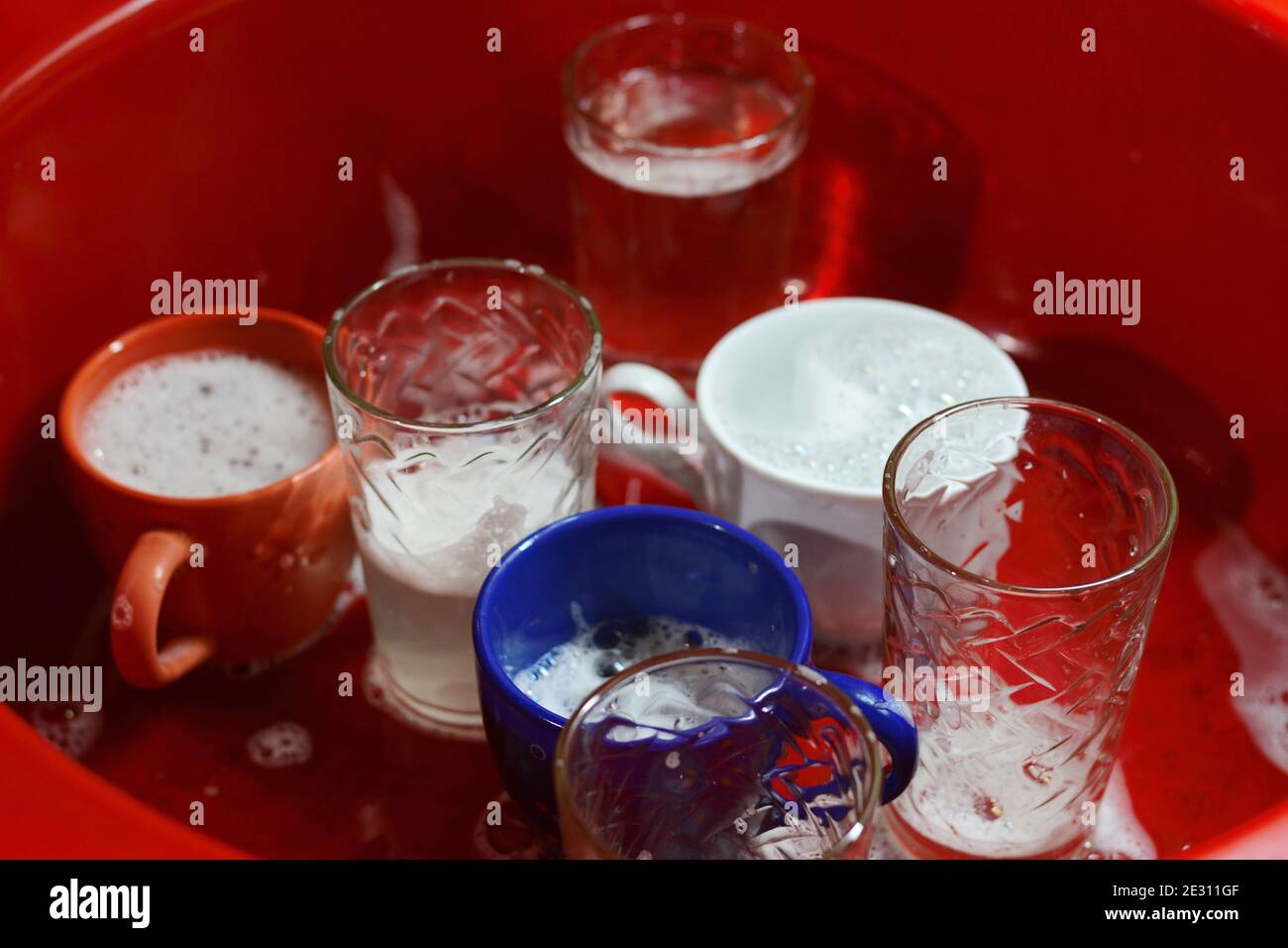 Dish washing. soaking in the kitchen sink. After the Dinner it's time