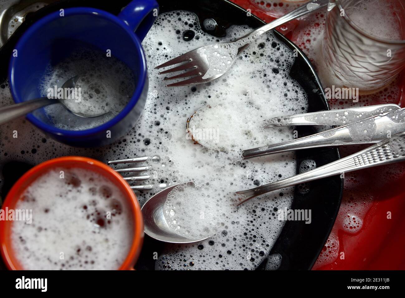 Dish washing. soaking in the kitchen sink. After the Dinner it's time to do the Dishes Stock