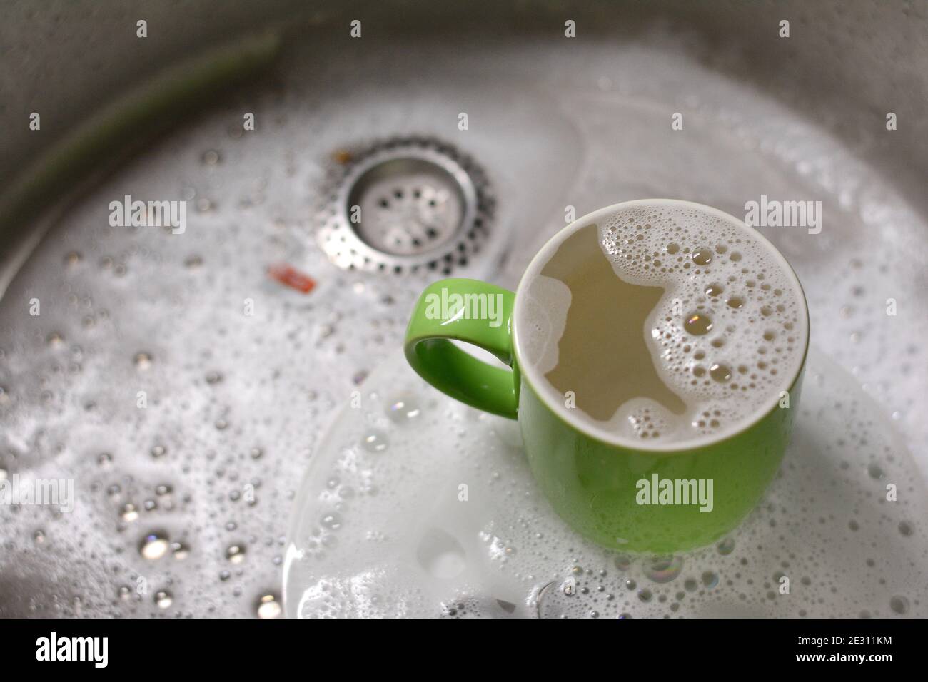 Dish washing. soaking in the kitchen sink. After the Dinner it's time