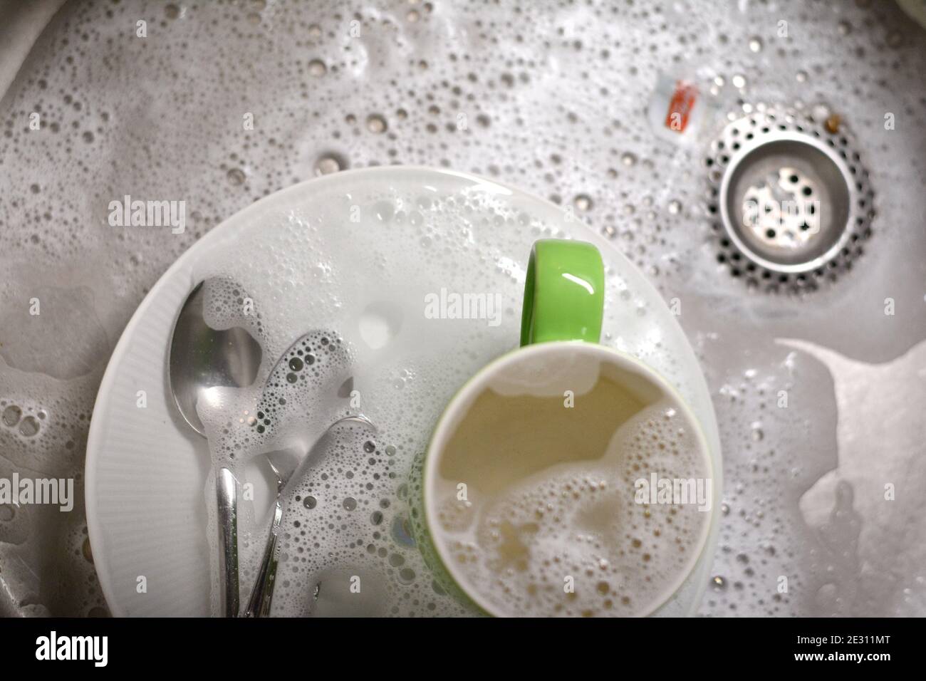 Dish washing. soaking in the kitchen sink. After the Dinner it's time