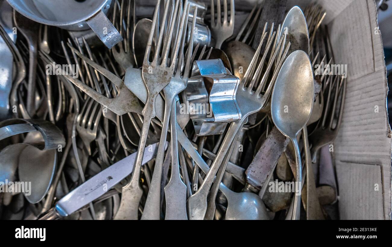 Drawer full of mismatched European cutlery and silverware Stock Photo