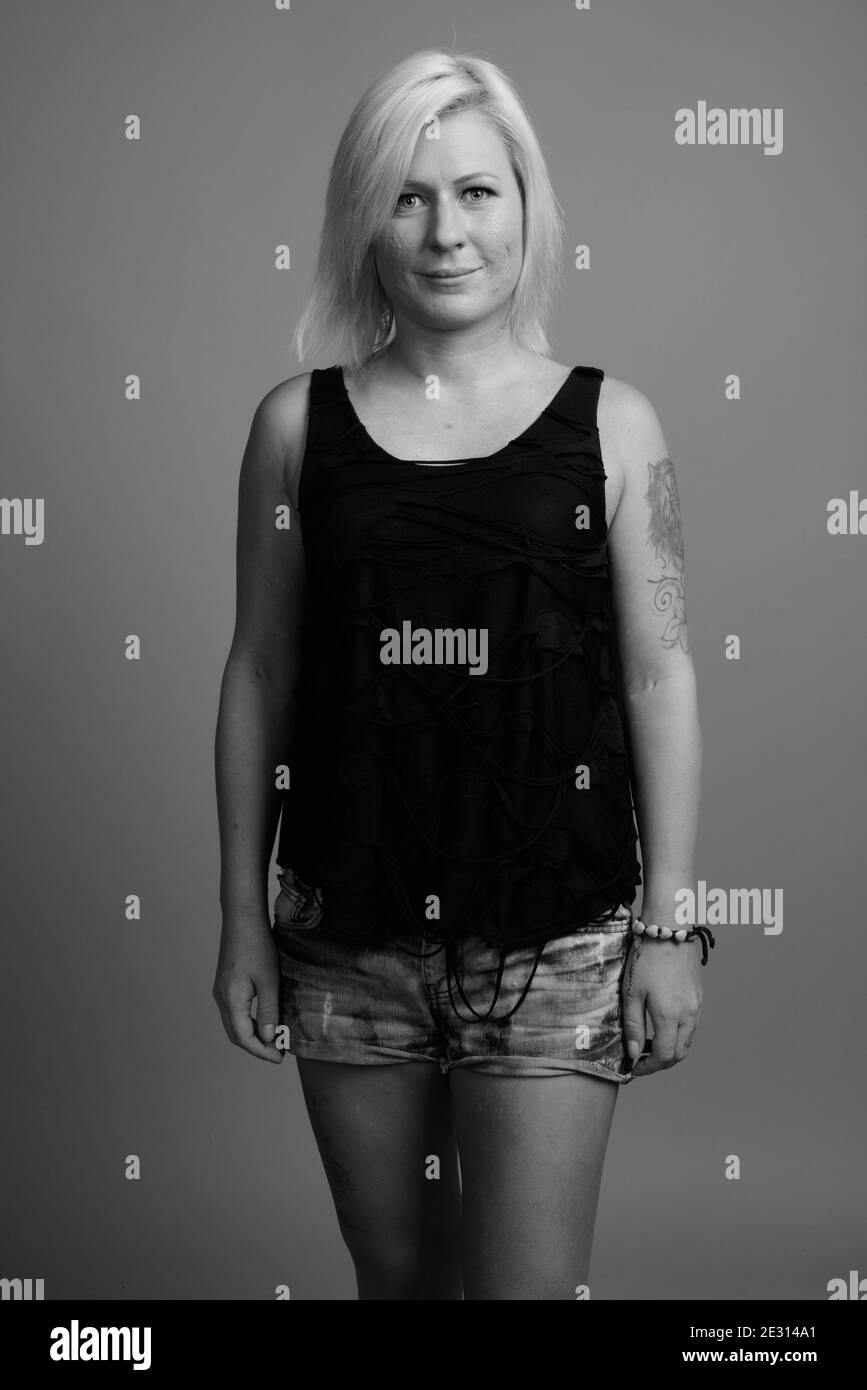 Blond girl tattoo hi-res stock photography and images - Alamy