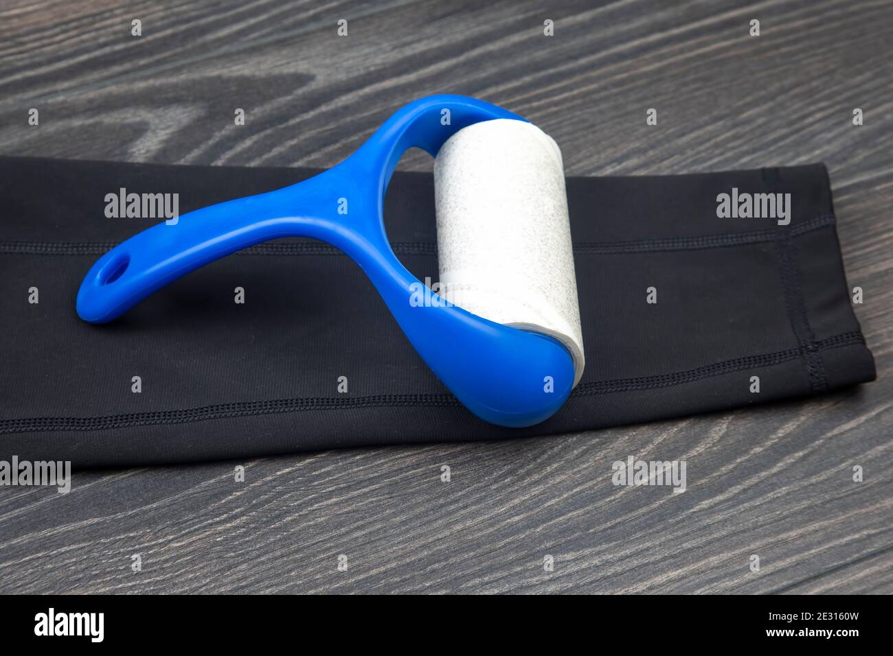 sticky plastic roller for cleaning clothes from dust, lint and hair Stock Photo Alamy
