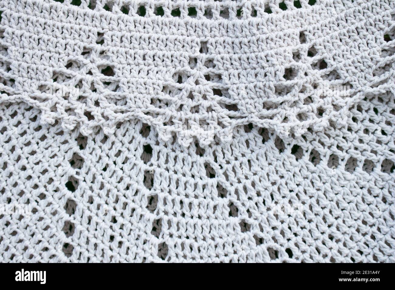 Two white crochets carpets over each other Stock Photo
