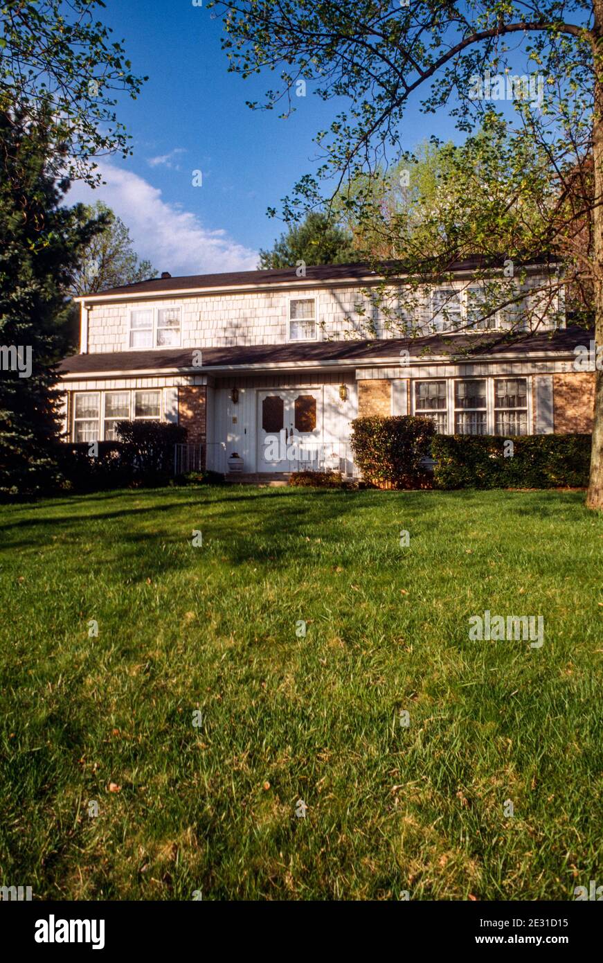 Suburban twostory house in Virginia is nicely landscaped, USA Stock