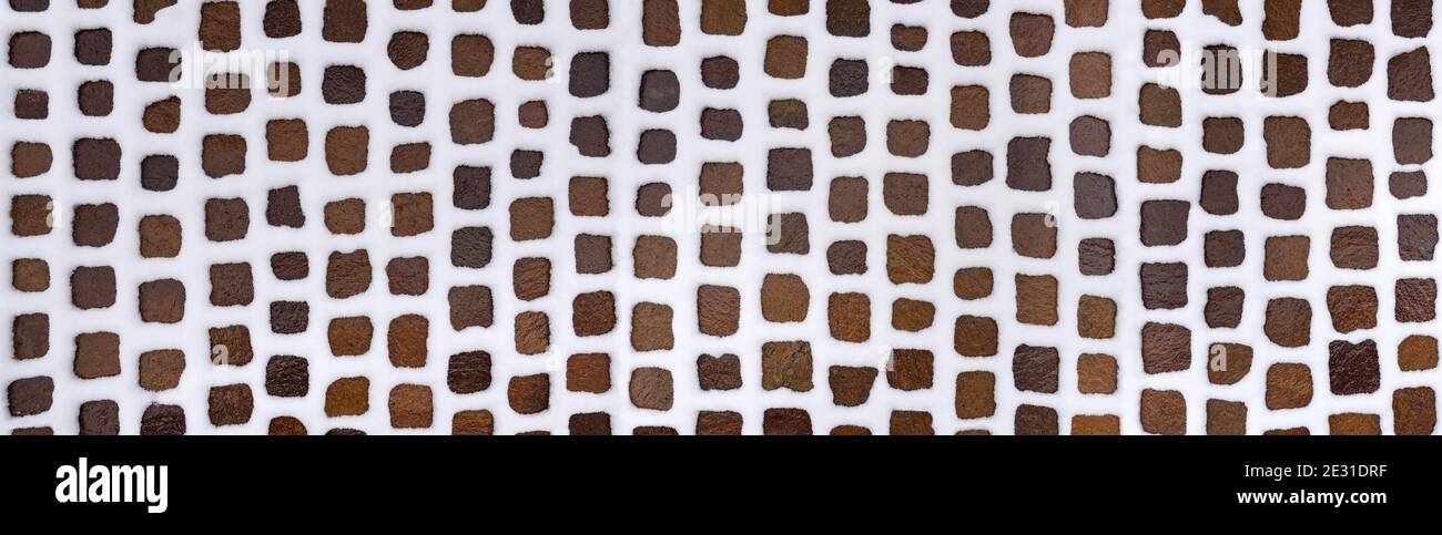 Snowy cobblestone pavement - panoramic close-up Stock Photo