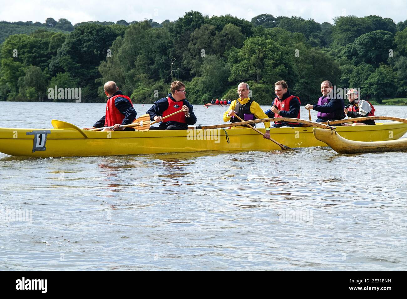 People paddling V6 Hawaiian outrigger canoes (known as va'a), UK Stock