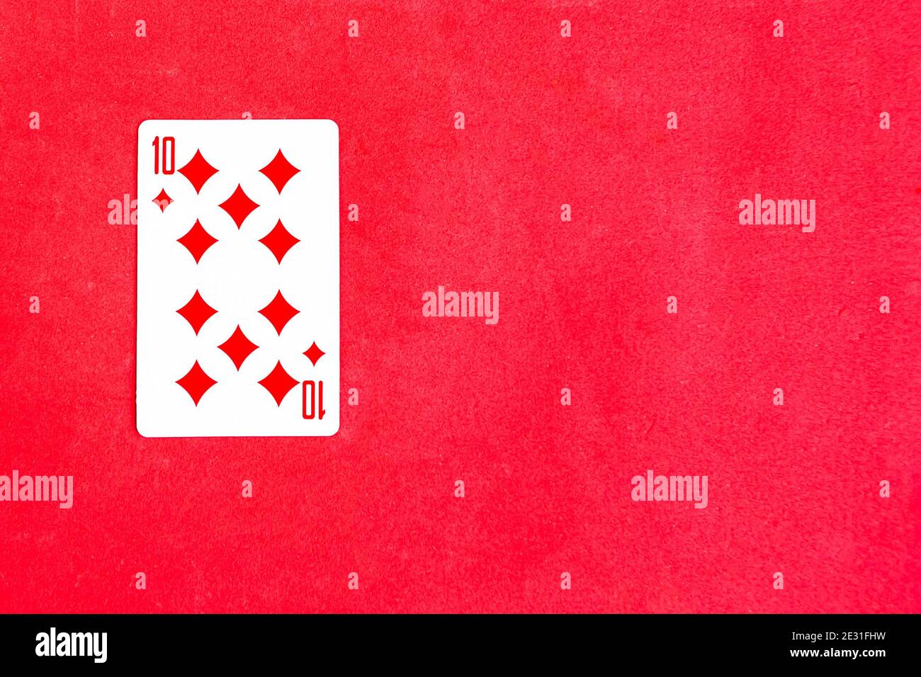 Ten of Diamonds playing card on red background, top view, copy space