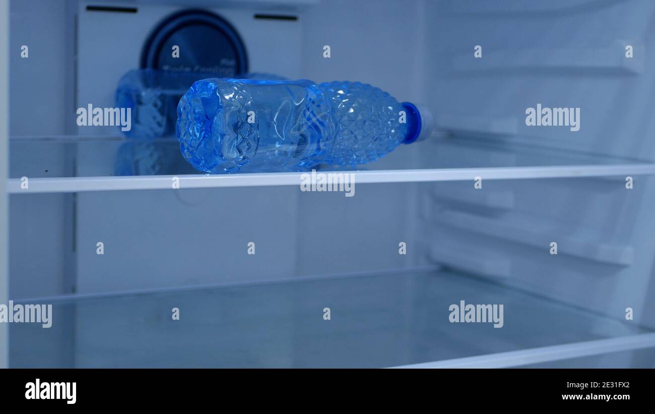Bottle Of Water In Fridge. Stock Photo, Picture and Royalty Free Image.  Image 70211863.