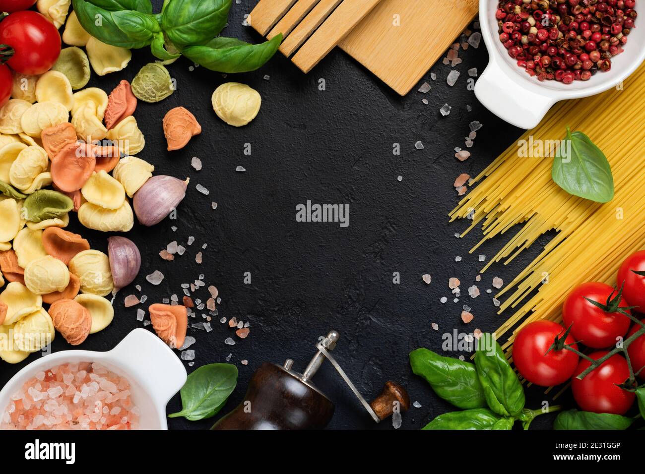 Italian Pasta orecchiette with traditional ingredients for the preparation  food on black background. Culinary food cooking background. Top view Stock  Photo - Alamy