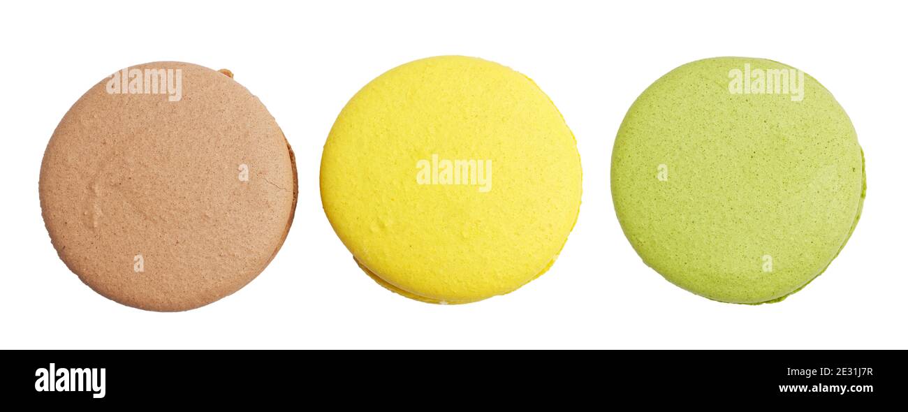 Closeup three different colored macaroons isolated on white. Top view. Stock Photo