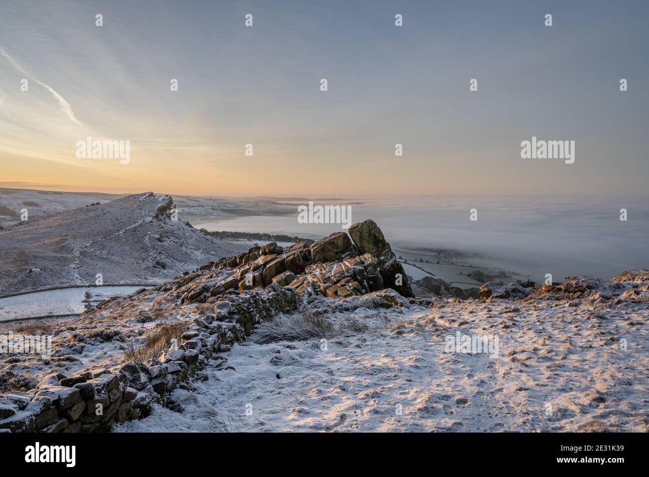 Sunrise temperature inversion at The Roaches during winter in the Peak District National Park. Stock Photo