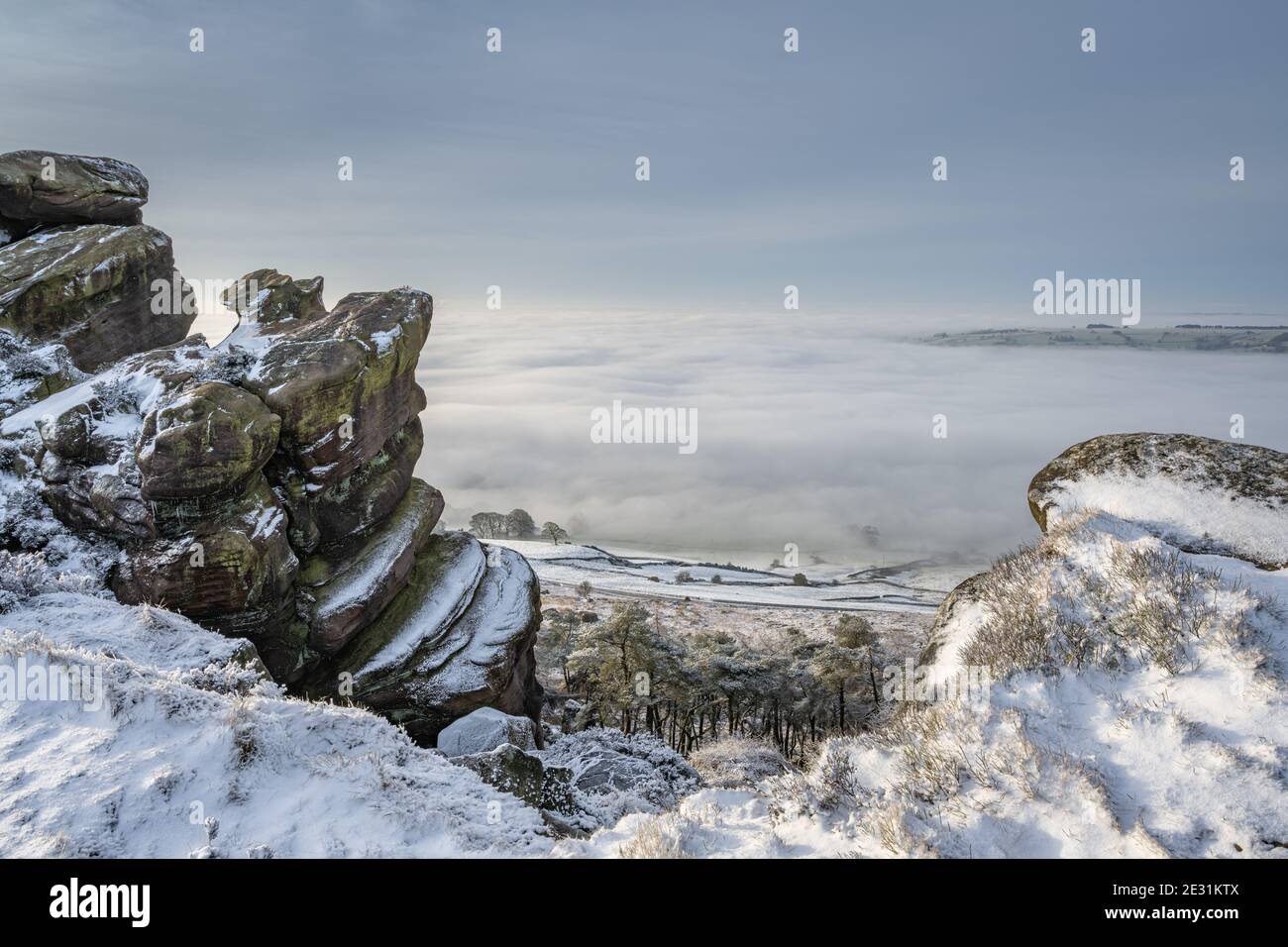 Sunrise temperature inversion at The Roaches during winter in the Peak District National Park. Stock Photo
