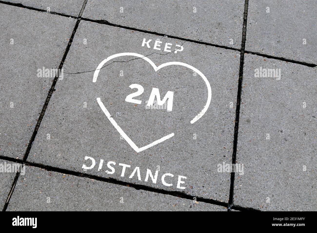 9 January 2021 London, UK - Sign on the ground in Charing Cross to remind people to keep 2m distance when entering the Underground during Coronavirus Stock Photo