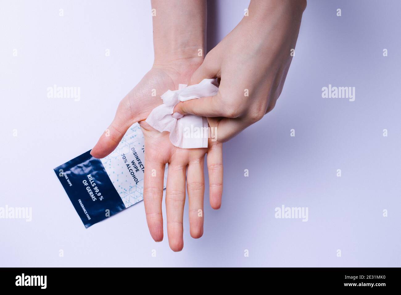 Using Hand Wipes Hands thoroughly wiping palms with antibacterial wipes on alcohol ...