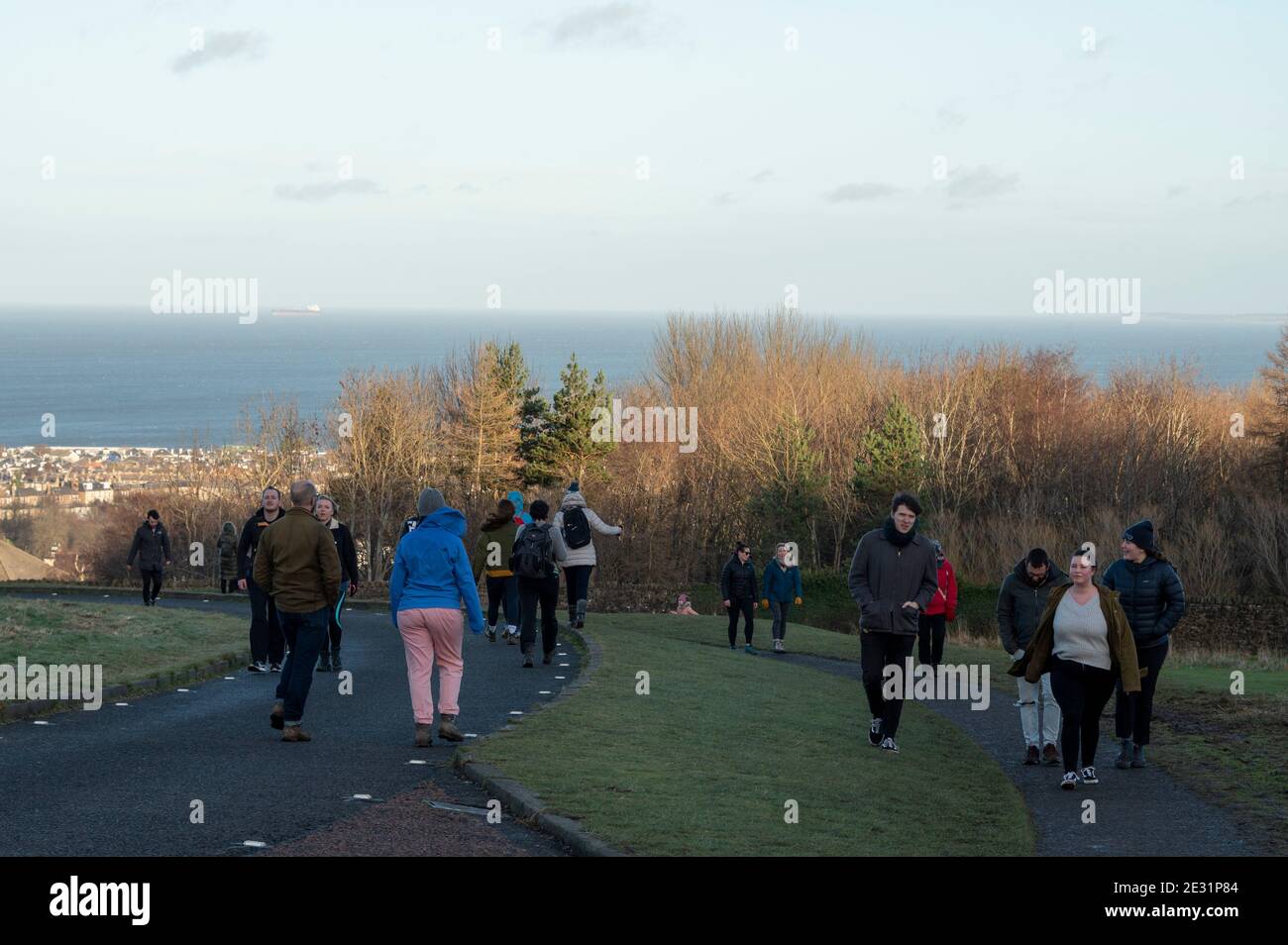 Edinburgh, Scotland, UK. 16th of January 2021: Coronavirus Daily Exercise. The roads and pathways in Holyrood Park were busy with people taking their daily exercise. For those up for the climb, the very top of Arthur's Seat gave some great views across Scotland’s capital city.Credit: Alamy Live News Stock Photo