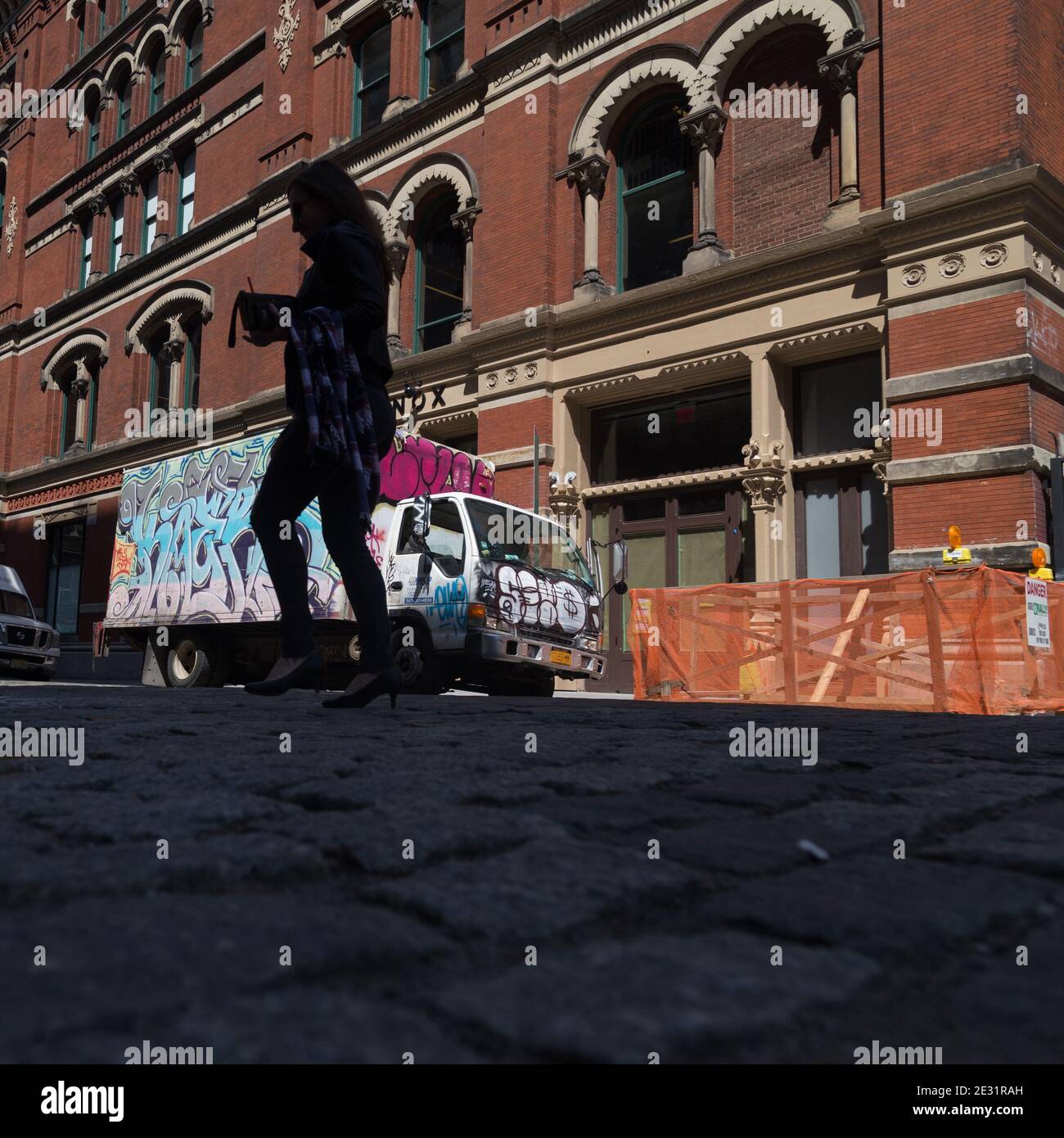 New York City, NY USA Graffiti Covered Truck On Cobblestone Covered Bond Street In NOHO Stock Photo