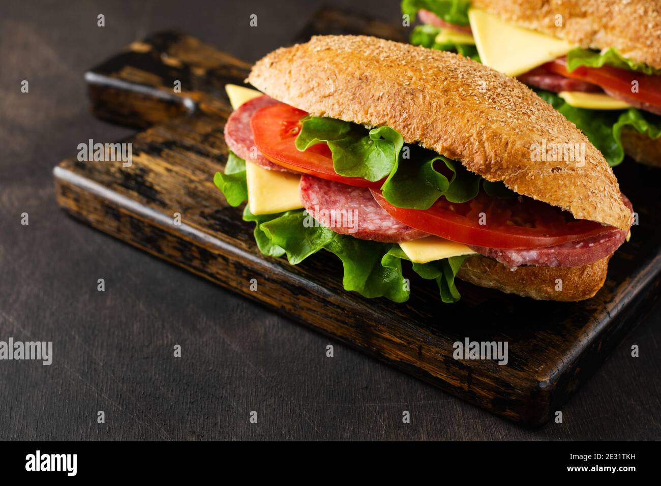 Healthy sandwiches with bran bread, cheese, lettuce, tomato and sliced