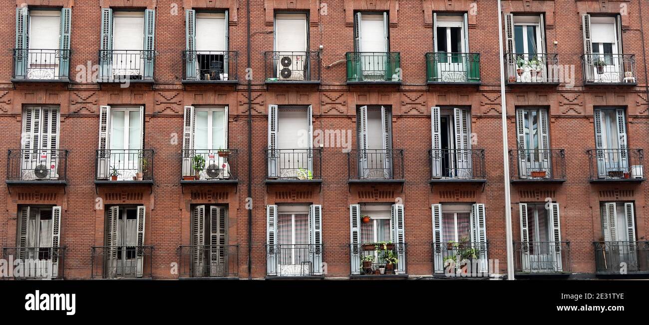 Facade of a brick building with balconies Stock Photo - Alamy