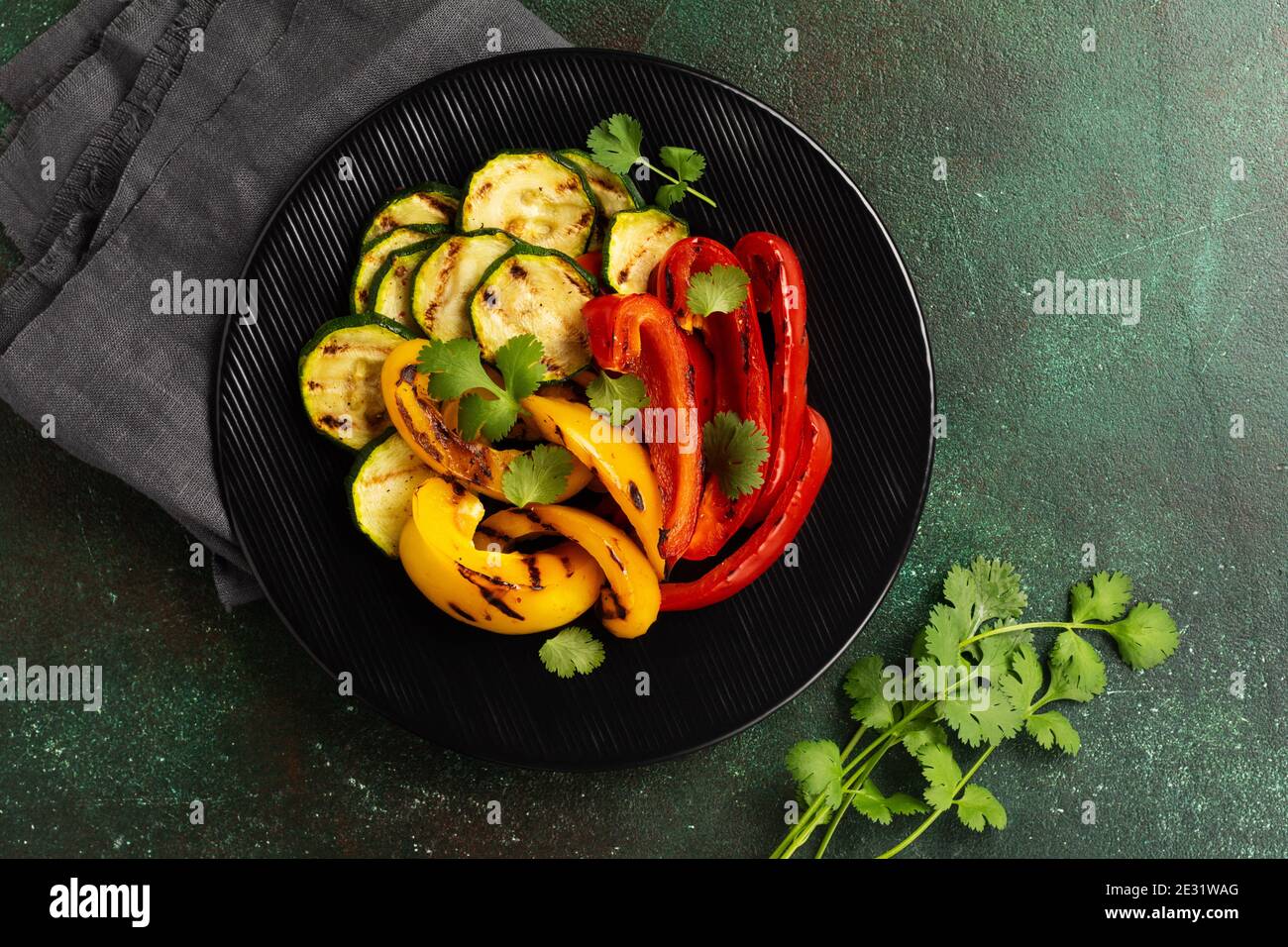 Grilled vegetables pieces of zucchini, red and yellow pepper and