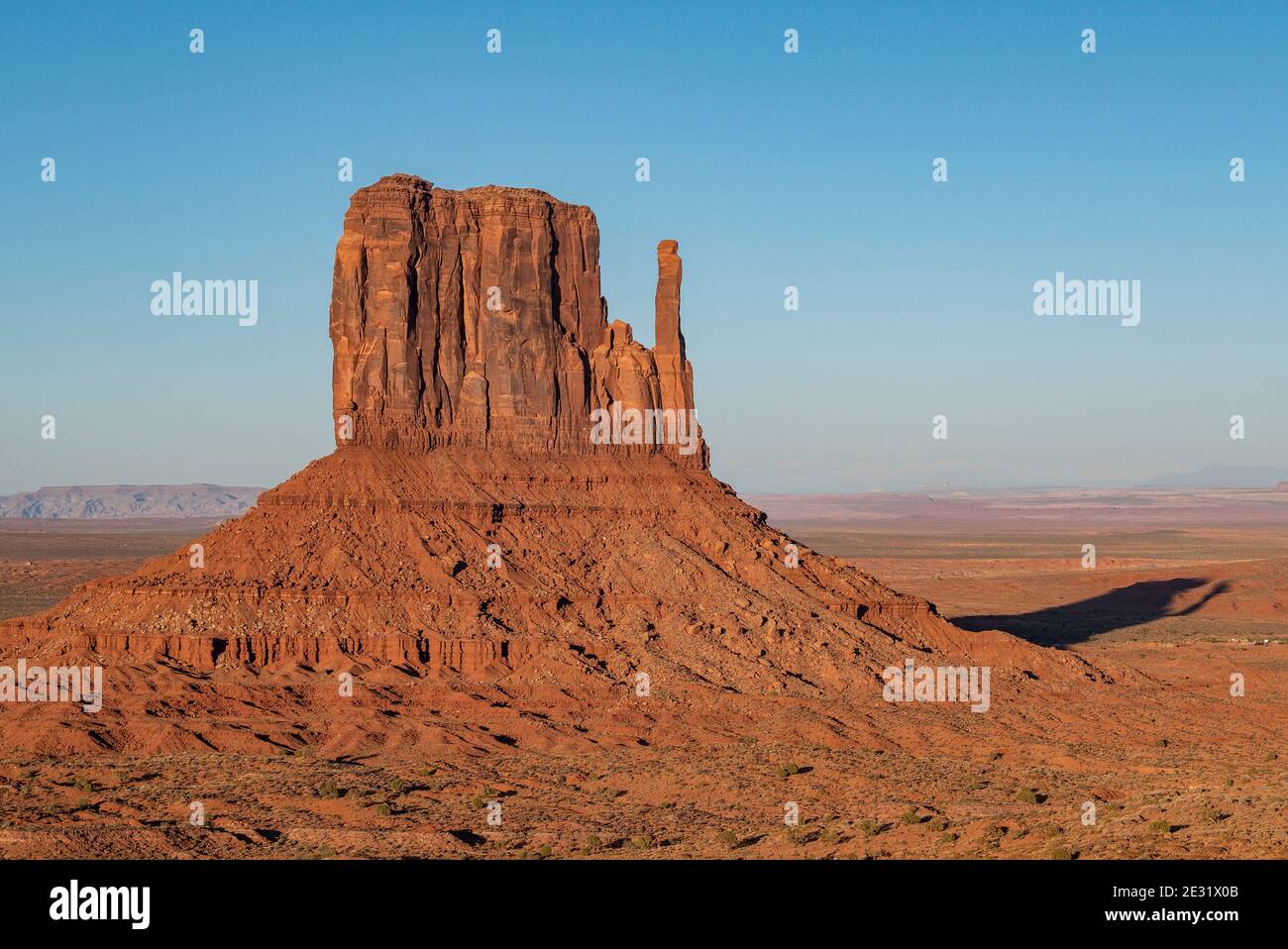 The famous West Mitten rock formation at sunset in Monument Valley Navajo Tribal Park which straddles the Arizona and Utah state line, USA Stock Photo
