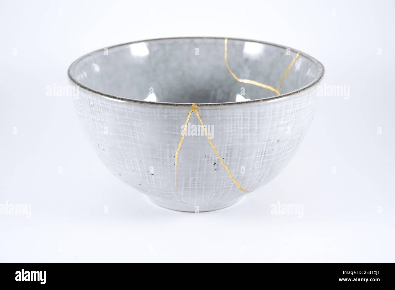 Gray Kintsugi bowl, real gold restoration, japanese technique Stock