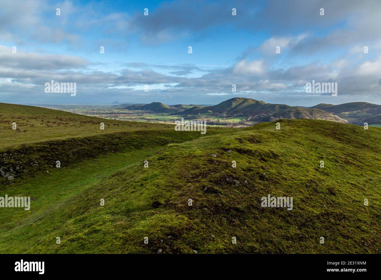 View from Bodbury Ring Hill Fort on the Long Mynd, Shropshire, England, with Caer Caradoc, The Lawley, with The Wrekin in the distance. Stock Photo