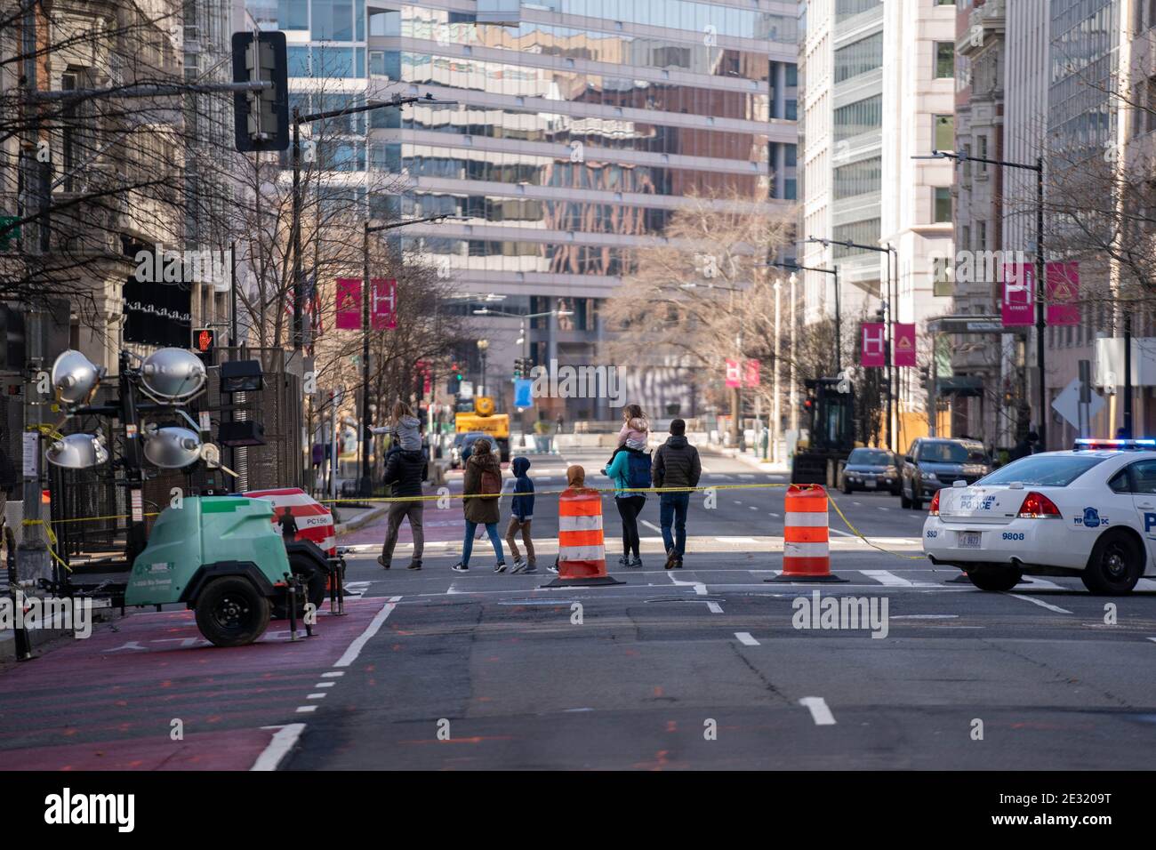 A family walks among closed off streets ahead of inaugural security ahead of the upcoming inauguration for President Joe Biden January 16, 2021 in Washington DC. Security is even tighter given there recent events when pro-Trump MAGA mobs breached the security perimeter and penetrated the U.S. Capitol back on Jan 6. Photo by Ken Cedeno/Pool/ABACAPRESS.COM Stock Photo