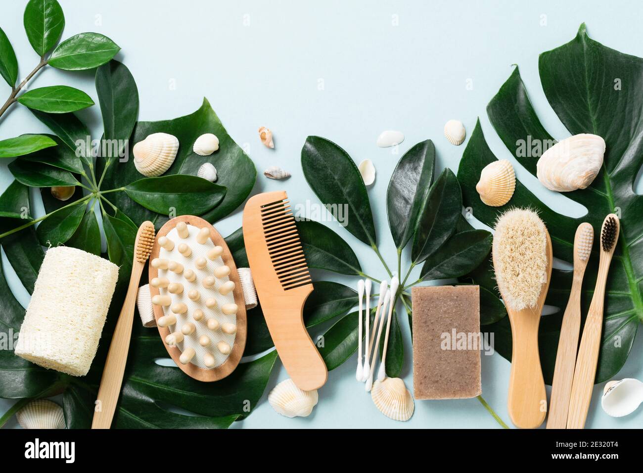 Eco friendly bathroom accessories or Spa tools on leaves monstera on