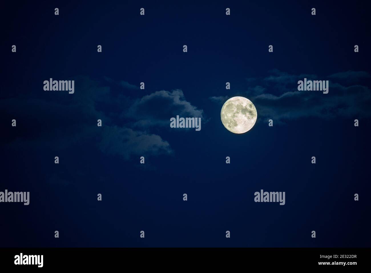 full moon in the night sky with clouds Stock Photo - Alamy
