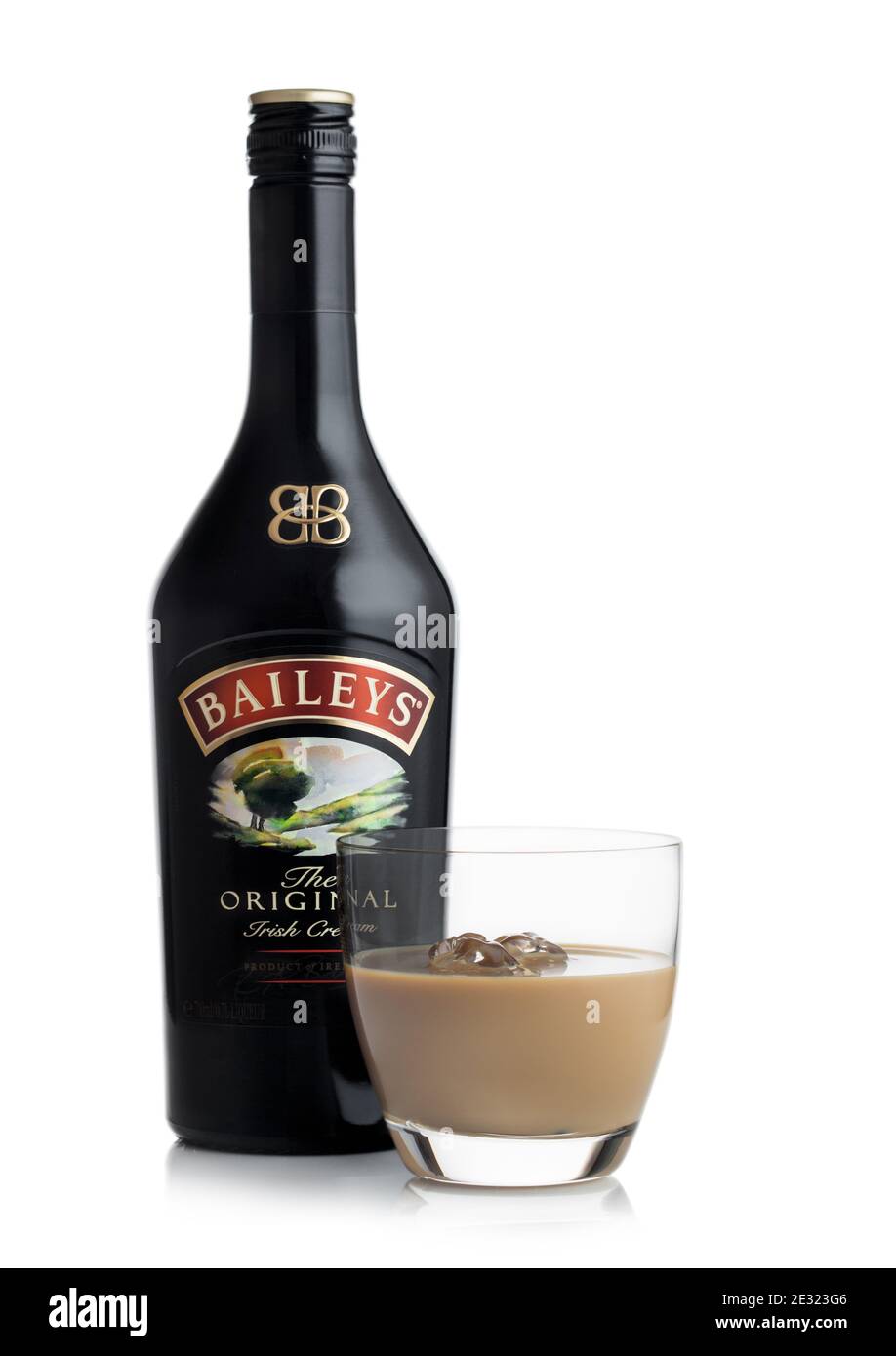 LONDON, UK - JUNE 02, 2020: Bottle and glass of Baileys Original Irish Cream on white background. Irish whiskey and cream based liqueur. Stock Photo