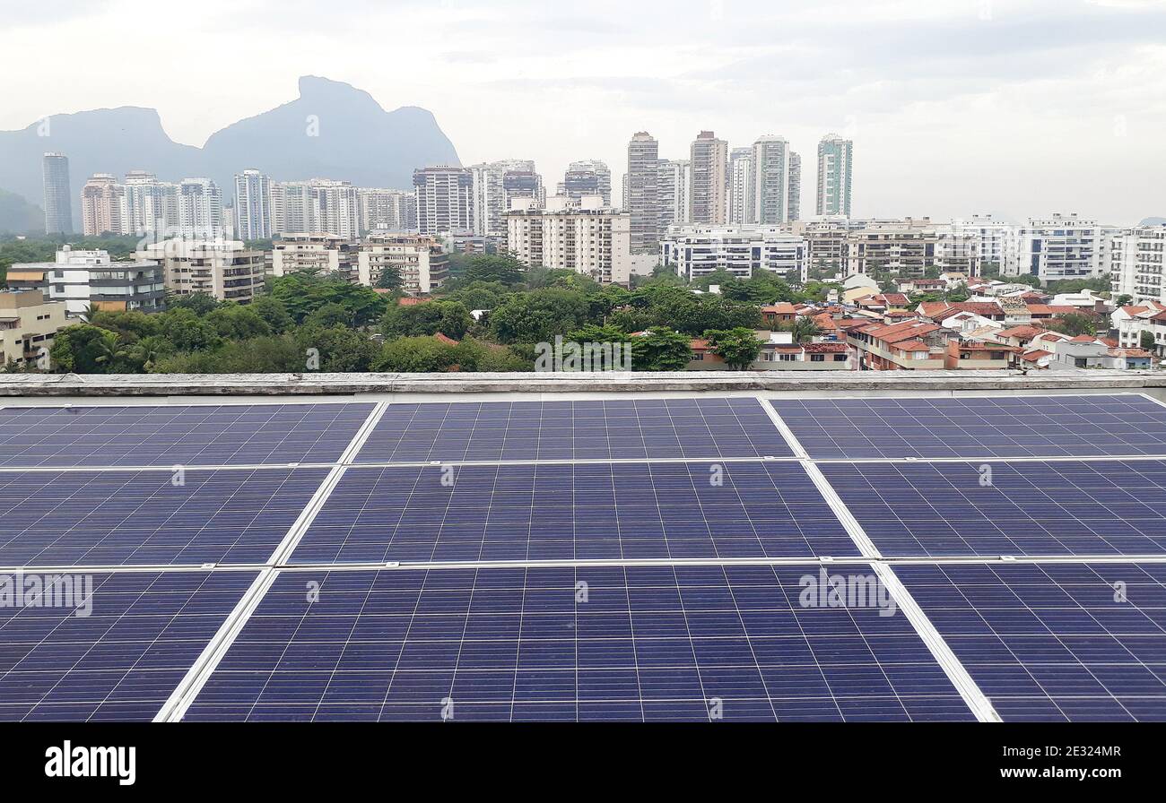 Solar panels to generate energy on the terrace of the building Stock Photo