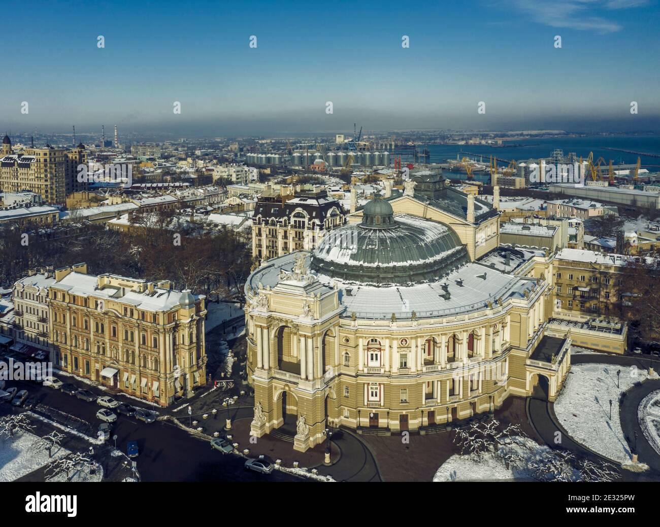 Air panorama of national opera and ballet theatre and sea port in Odessa Ukraine. Drone footage, winter time and sunny day. Stock Photo