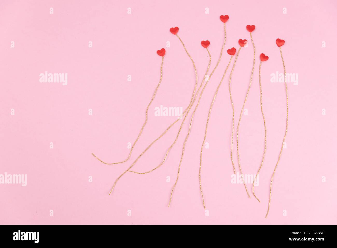 Valentine's day greeting card template. Pink background with small red ...