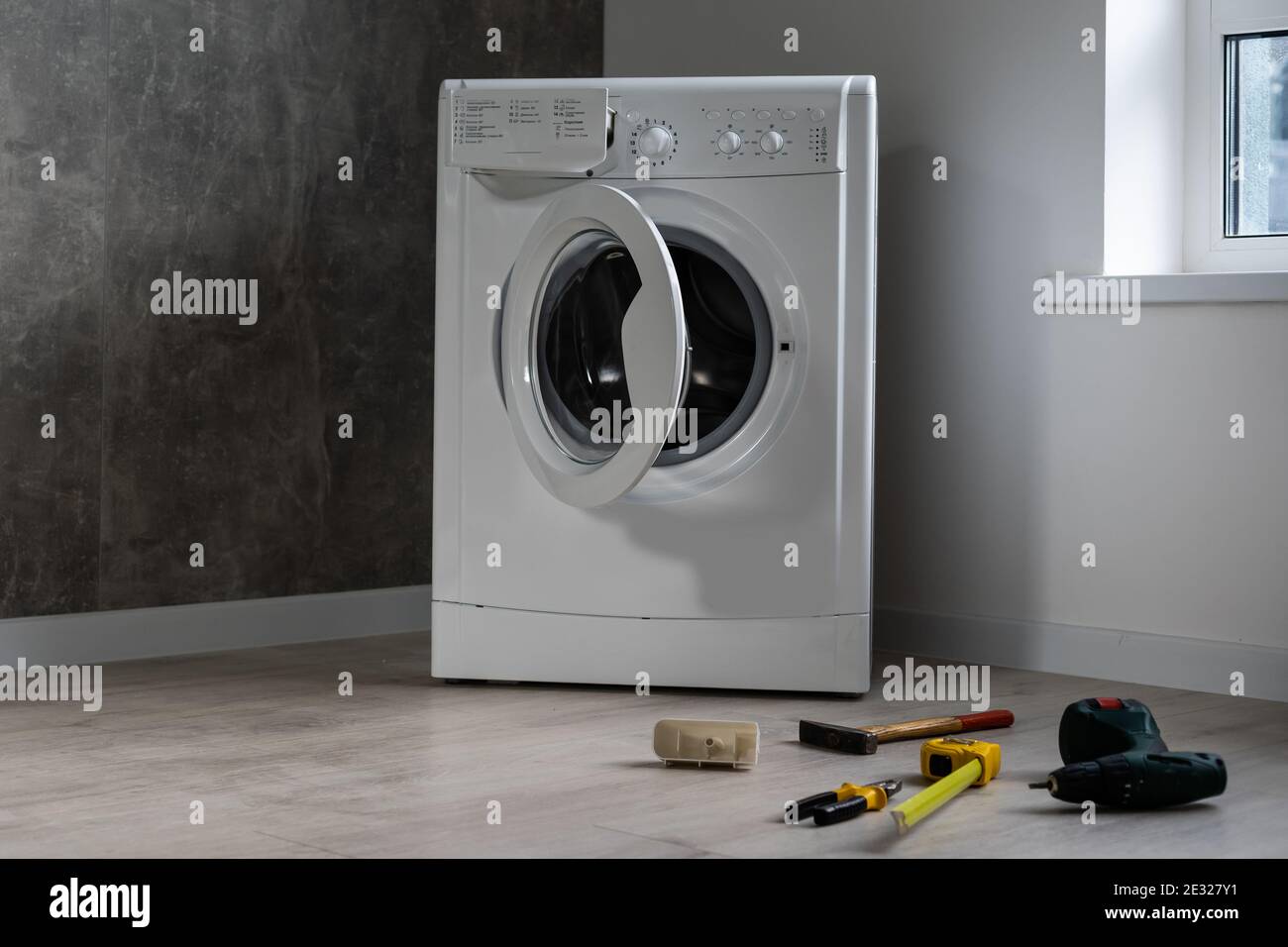 broken washing machine in the apartment Stock Photo Alamy