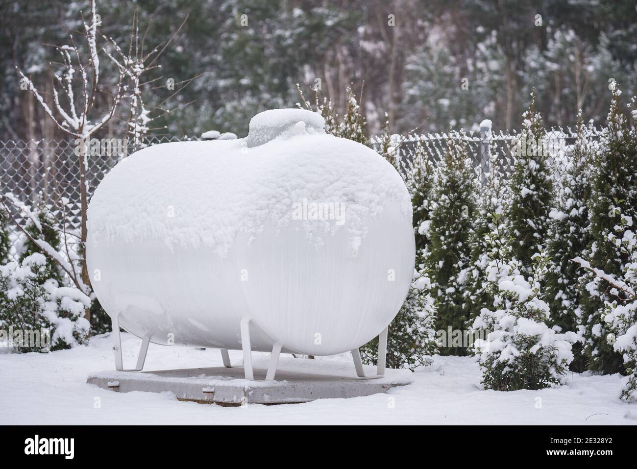 Gas fuel tank for home heating. Winter in the countryside and a