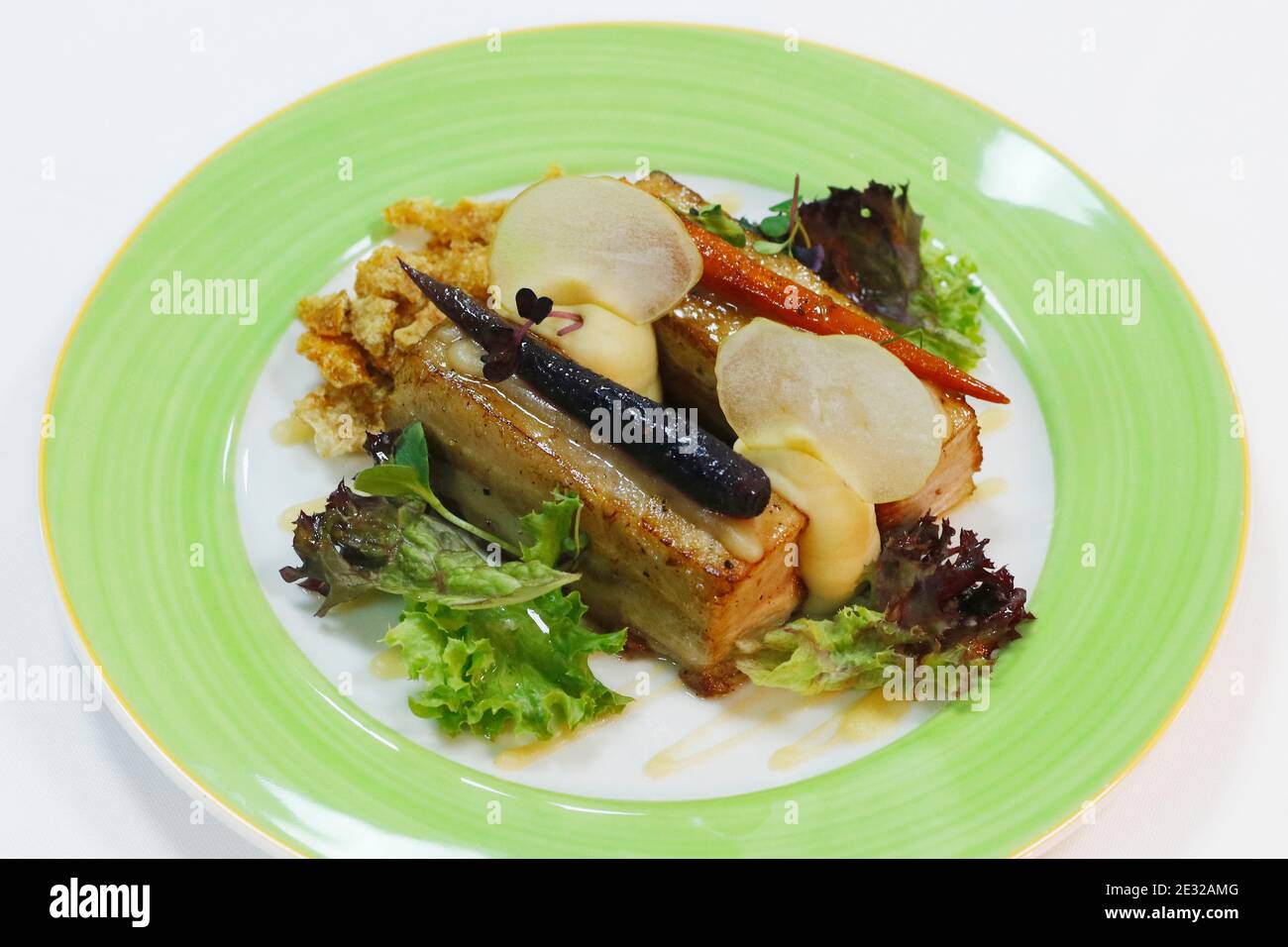 roasted pork belly with crackling, salad leaves and mash potato Stock Photo