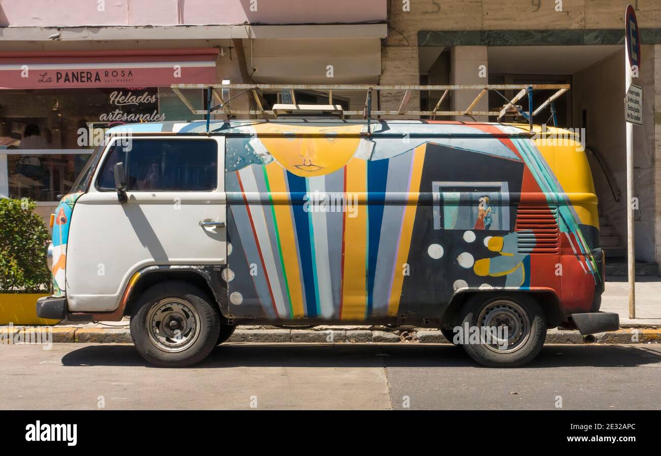 Brightly coloured rusty old VW Camper van Stock Photo
