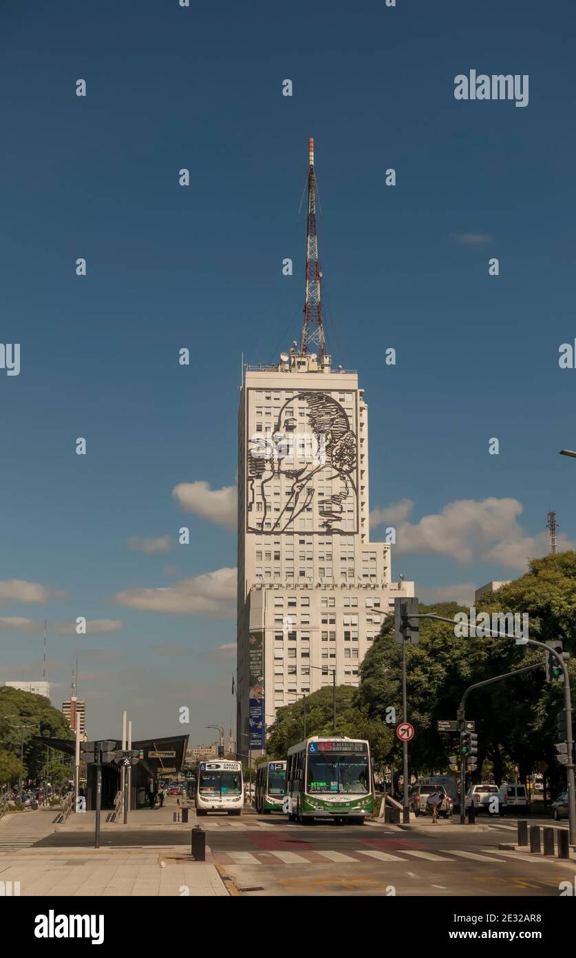 Busses on Avenida 9 de Julio, Buenos Aires, Argentina go past an image of Eva Peron on the CGT Union syndicate building Stock Photo