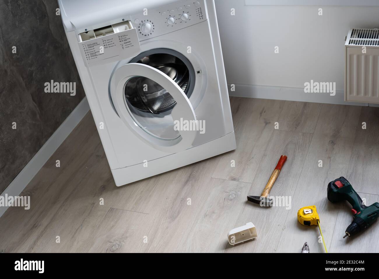 broken washing machine in the apartment Stock Photo Alamy