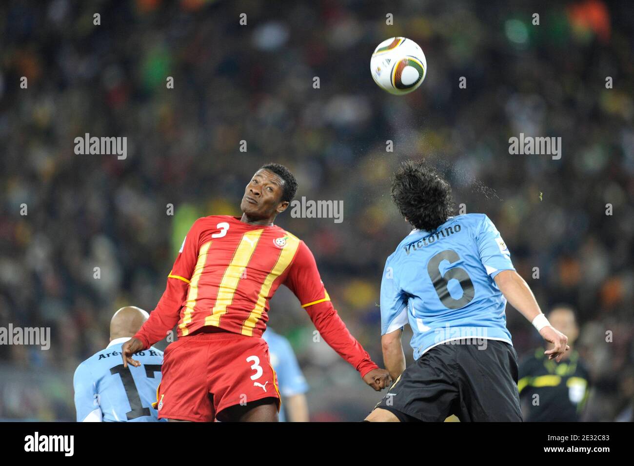 Ghana's Asamoah Gyan battles for the ball with Uruguay's Mauricio Victorino during the 2010 FIFA World Cup South Africa, Quarter Final, Soccer match, Ghana vs Uruguay at Soccer City football stadium in Johannesburg, South Africa on July 2nd, 2010. Uruguay won 0-0 (5p to 4). Photo by Henri Szwarc/ABACAPRESS.COM Stock Photo