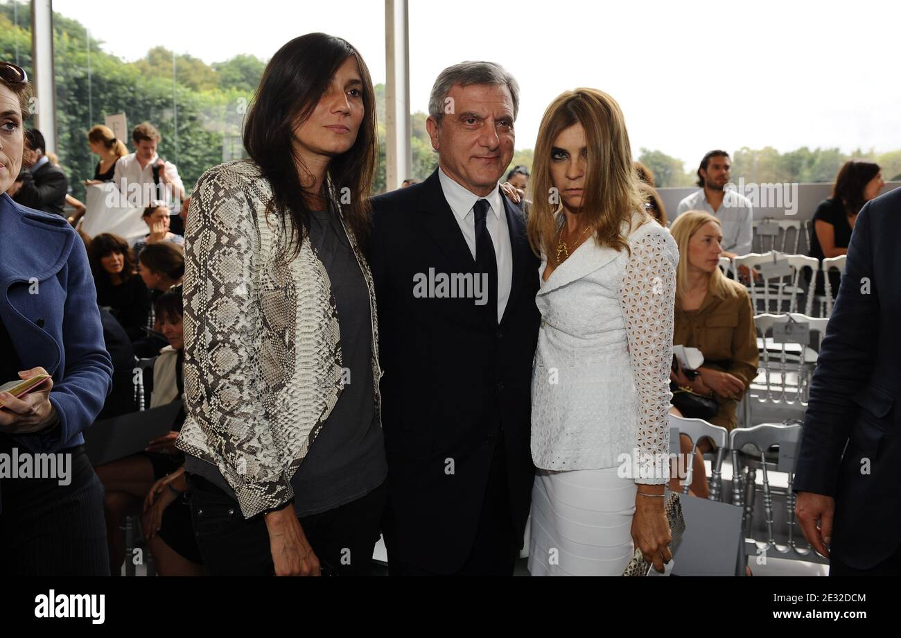 Bernard Arnault's daughter Delphine (C), Dior CEO Sidney Toledano (L) and  French fashion stylist Pierre Cardin pose beside items on display after a  press conference at the occasion of Christian Dior's centenary
