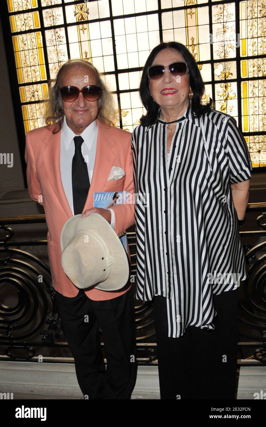 Nana Mouskouri and husband Andre Chapelle arriving for the Fall-Winter  2010/2011 Haute-Couture fashion show of French designer Jean-Paul Gaultier  held at the designer's headquarters in Paris, France on July 7, 2010. Photo